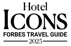 The image features the text "Hotel ICONS Forbes Travel Guide 2025" in a bold, elegant font style.