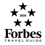 The image shows the Forbes Travel Guide logo with five stars and the year 2026 in the center.