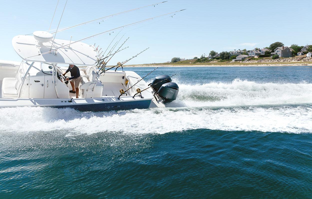Man dirving a boat in the ocean