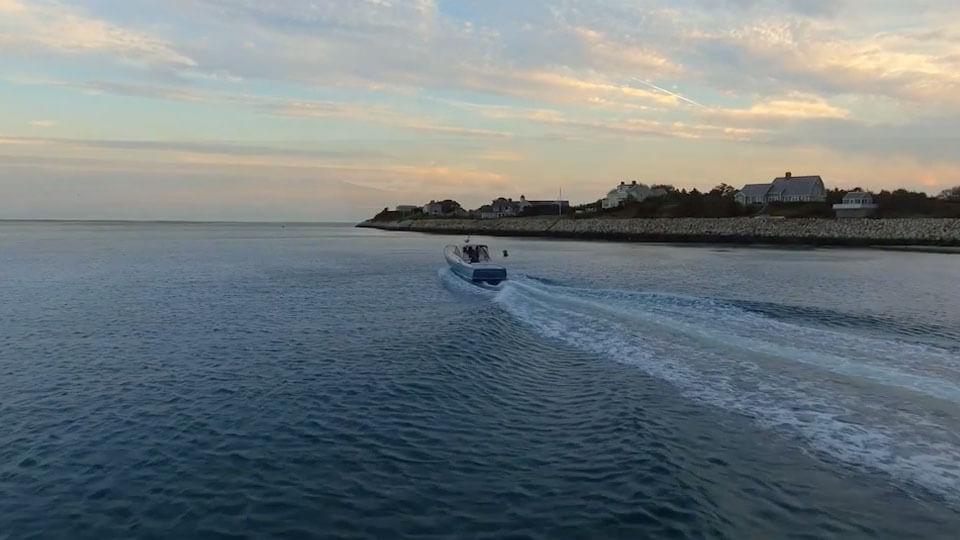 Boat in the ocean at sunset