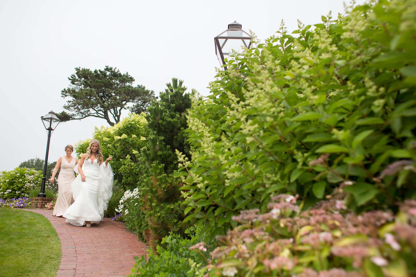 Bride and bridesmaid walking together