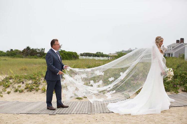 Man holding brides veil