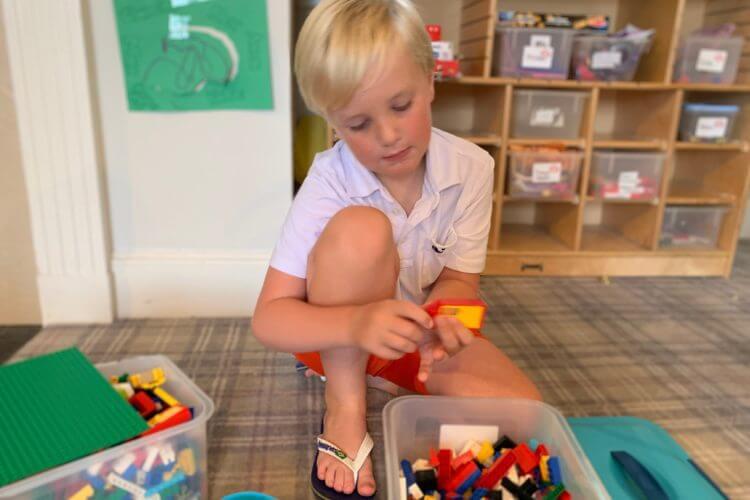 Child playing with lego