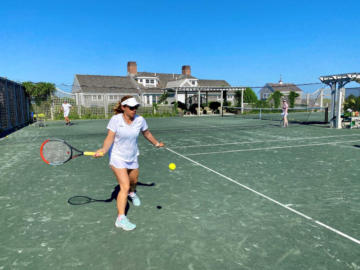 Lady playing tennis at Chatham Bars Inn