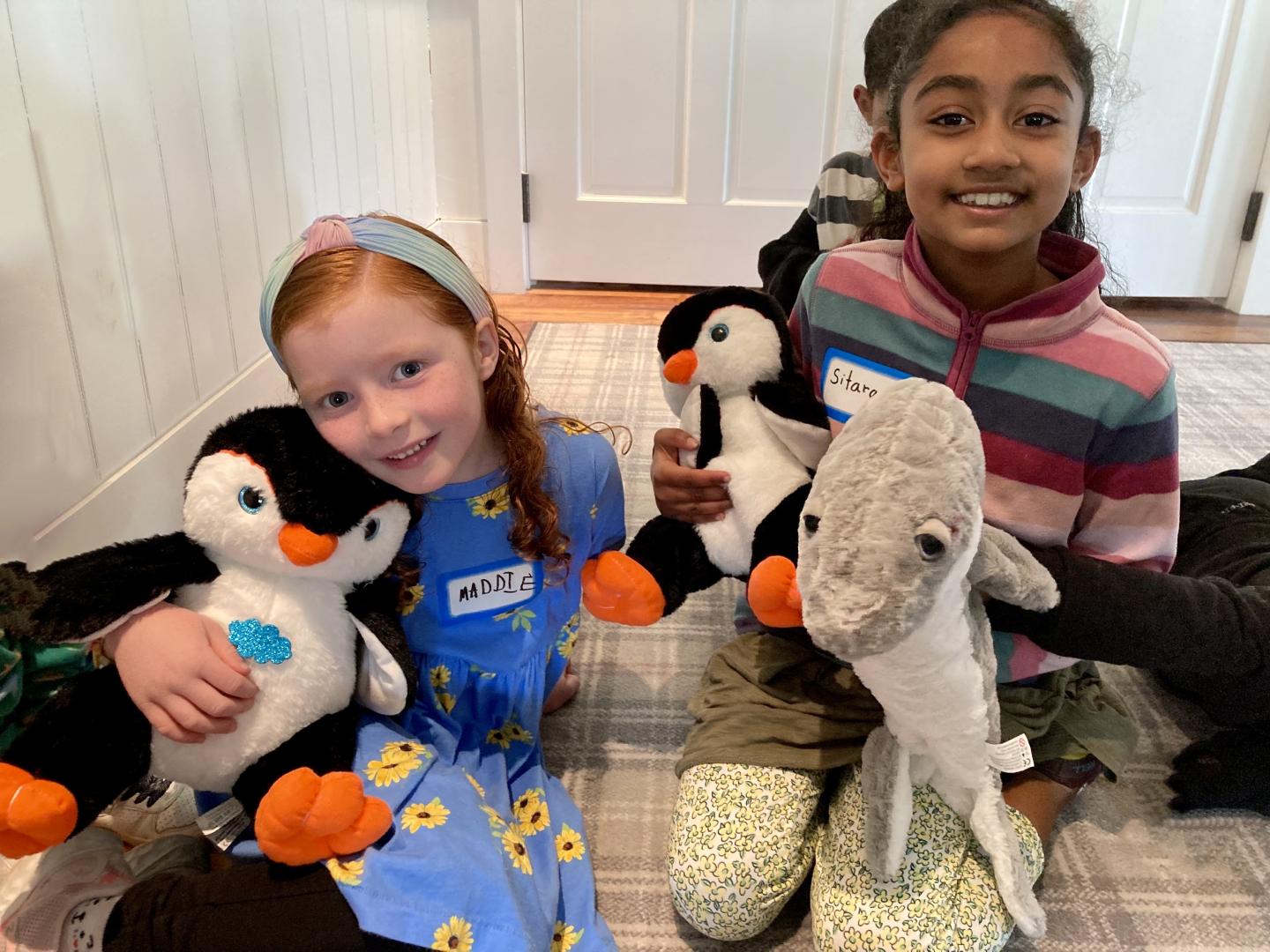 two children after building stuffed animals