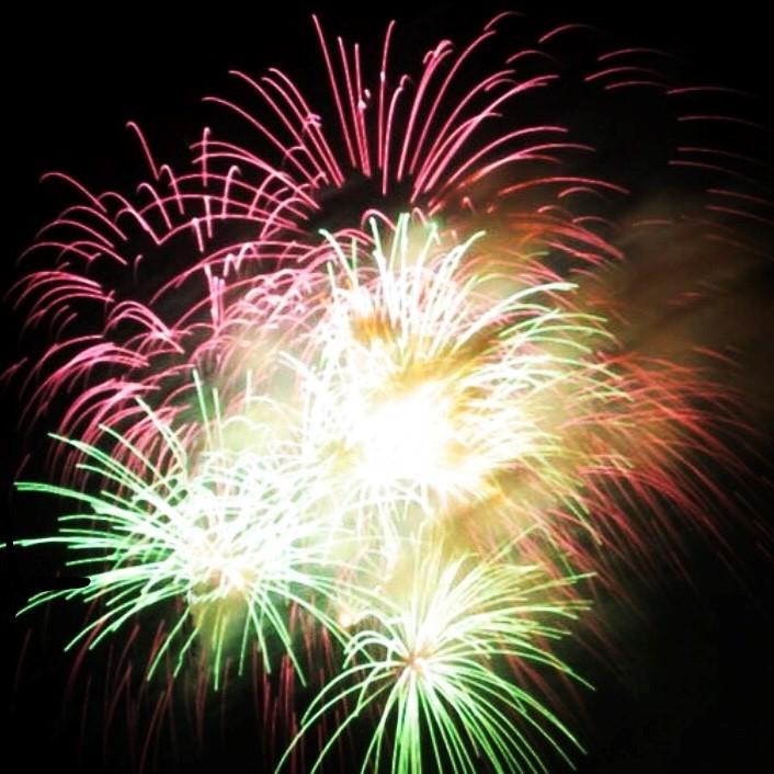 red white and green fire works at night
