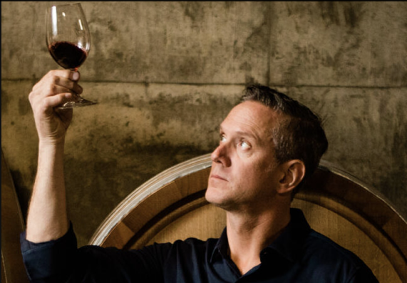 Drew Bledsoe with a glass of wine