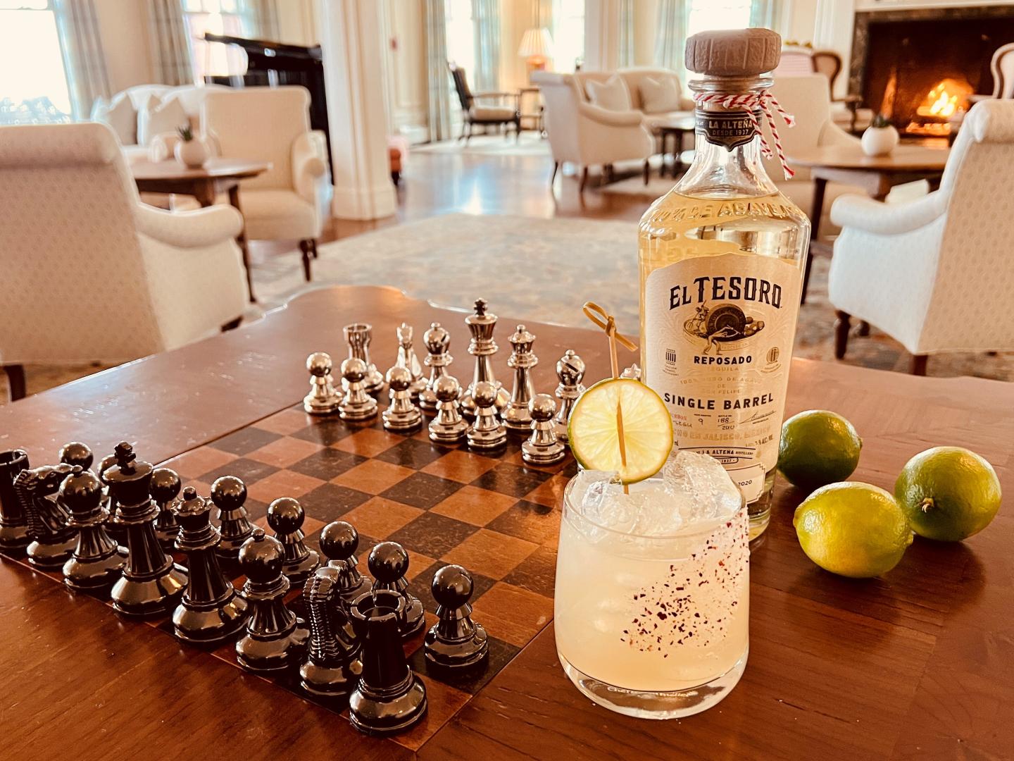 Tequila bottle beside a chess board