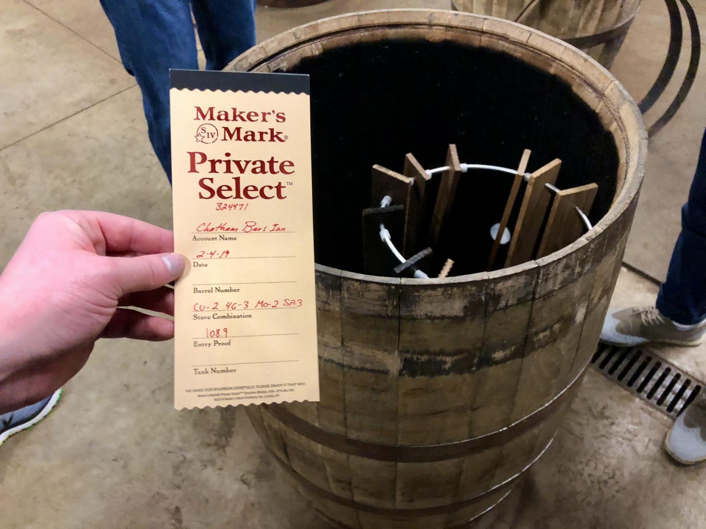 A hand holding a brewing label