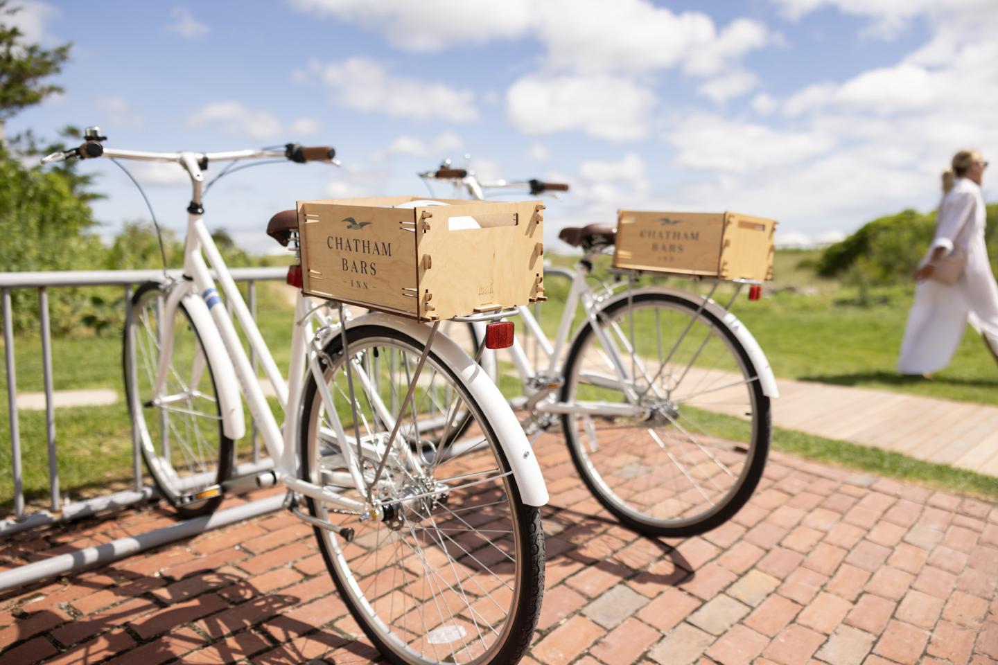 bikes with guest walking past